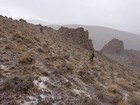 Wind and snow starting to blow on our way up the upper peak.