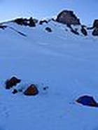 View from Camp Muir. Adams, Hood, and Saint Helens poking up through the clouds.