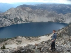 Sean the photographer on Alpine Peak, with Sawtooth Lake in the background.