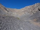 Only way through the cliffs is at the head of the valley.