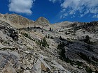 Starting to get above tree-line, Decker Peak on the right. Our next camp would be at the small tarn not far from the big tree in the center.