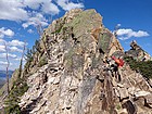 John contemplating his next move on the way up Huckleberry Peak.