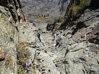 Michael downclimbing the steep gully to get off He Devil.