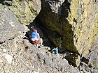 Downclimbing a chimney on the south ridge of Tower of Babel.