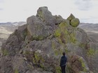 Contemplating the crux move below the summit.