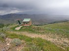 At the top of the ski area, means the trailhead is in reach.