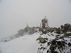 Splattski hidden in the fog amongst old equipment on the summit of West Sonoma Peak.