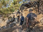 Hiking through some rock outcroppings on the trail.