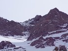 Close up of a mountain goat on the summit ridge.