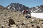 Group photo taken on Four Lakes pass, with Castle Peak behind us.