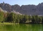 The low point in the ridge and the scree chute that lead to it are known as the Devil's Staircase. One of the Born Lakes is in the foreground.