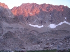 Alpenglow from the sun setting on the northwest side of Castle Peak.