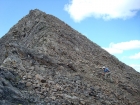 John climbing through the talus on the northeast slopes of Iron Basin Point.