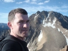 Dave on the summit of Merriam Peak, Castle Peak in the background.