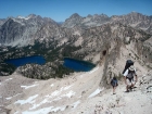 JJ and Bill climbing along the ridge north of Pt 9769', with Baron Lakes in the background.