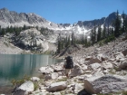 Bill hiking along the shore of Packrat Lake. We've got to find a way over that ridge in the background.