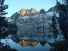 Sunset alpenglow on Elk Peak, reflecting in Lake Kathryn.