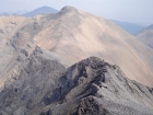 Climbers making there way up the north ridge of Wet Peak, with Hidden Peak behind.