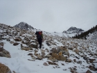 John nearing Sawmill Pass, Leatherman and Badrock in the background.