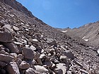 Michael crossing the steep and never-ending boulder field on the east side of Lake Helen of Troy.