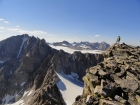 Chris on the summit of Jackson Peak. Fremont Peak on the left, Mount Helen and Gannett Peak visible in the distance.