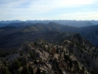 Looking back at the east ridge route, with the Sawtooths in the background.