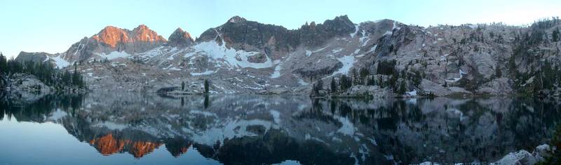 Panoramic view from Lake Kathryn, highlighted by alpenglow on Elk Peak.
