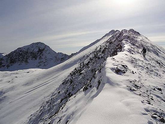 Sean descending Murdock's north ridge, Mallory Peak on the left.