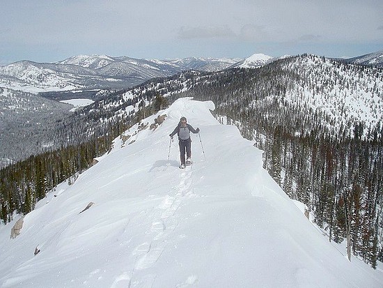 John on the cornice covered ridge leading to Spring Peak.